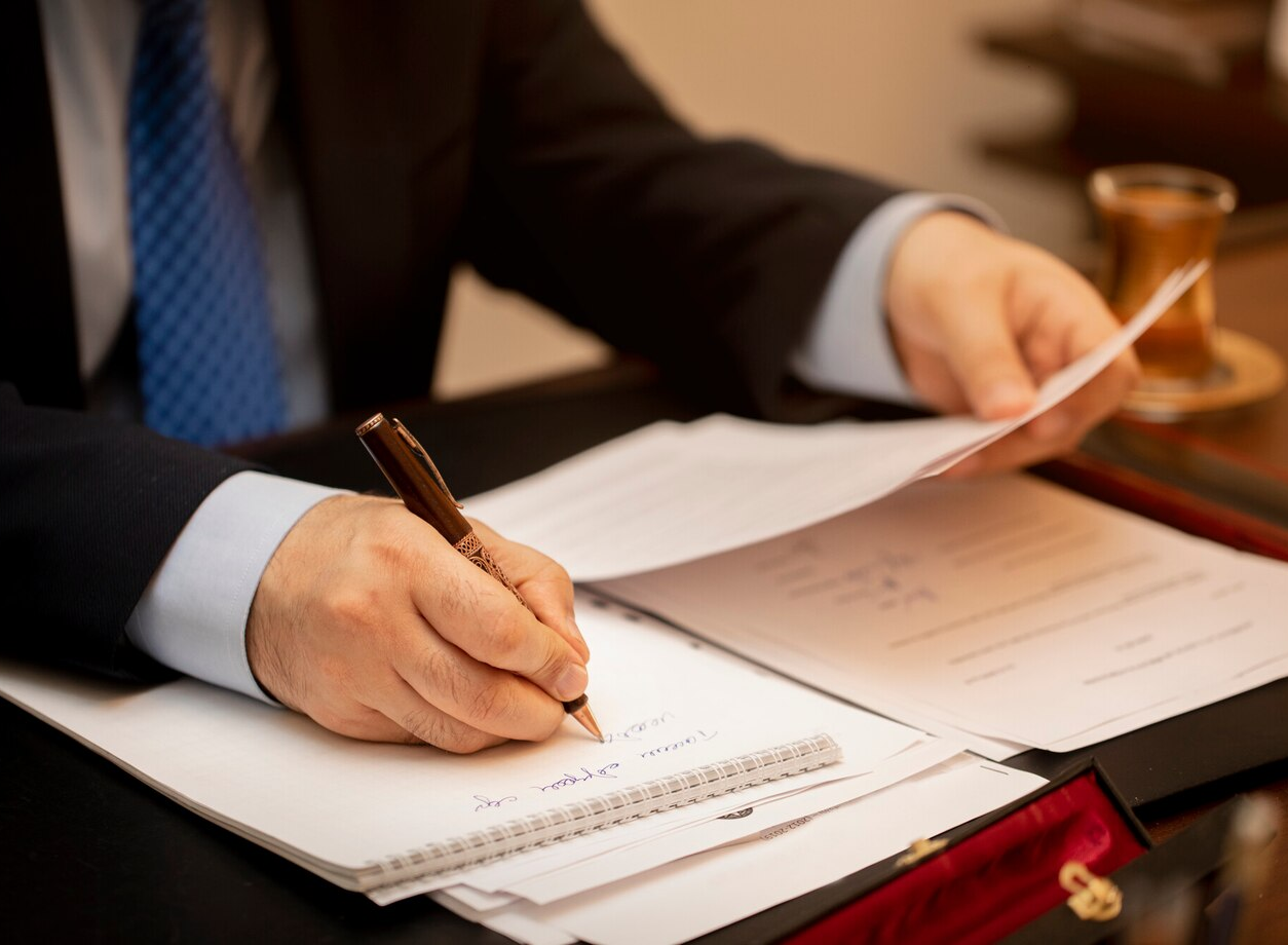 Businessman signing important contract papers